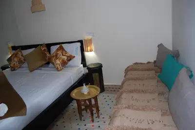 a hotel room with a bed and a couch at Dar 