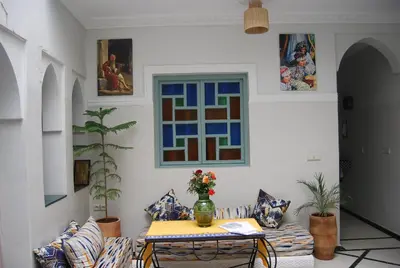 a living room with a couch and a table at Dar 