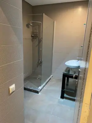 a bathroom with a shower and a sink at studio design carre eden gueliz IPTV , NETFLIX , WIFI, in Marrakech