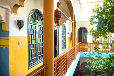 a hallway of a building with stained glass windows at Riad Dia in Marrakech