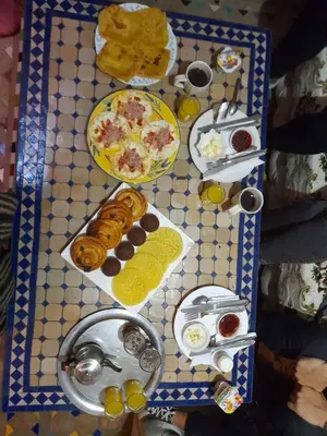 a table with plates of food on top at Riad Dia in Marrakech