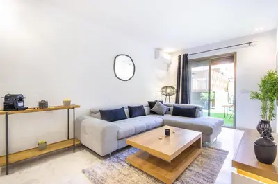 a living room with a couch and a coffee table at NEW!, Jardin privé, transats, barbecue in Marrakech