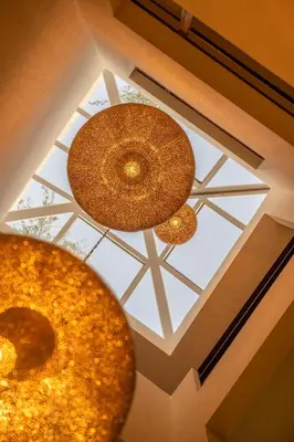 two lights on the ceiling of a building at Riad Dar Labzar in Marrakech