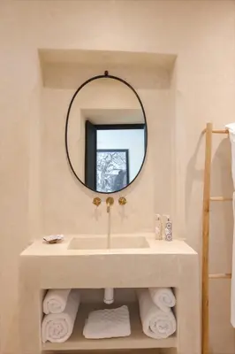 a bathroom with a sink and a mirror at Riad Dar Labzar in Marrakech