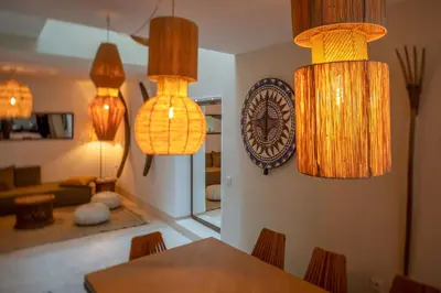 a dining room with a table and some lights at Riad Dar Labzar in Marrakech