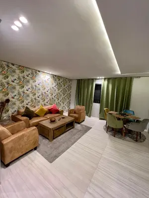 a living room with a couch and a table at Appartement 2 chambres salon a cote centre de Gueliz 12 in Marrakech