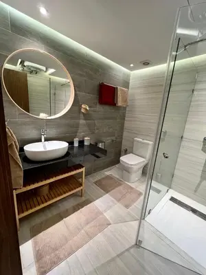 a bathroom with a sink and a mirror at Appartement 2 chambres salon a cote centre de Gueliz 12 in Marrakech