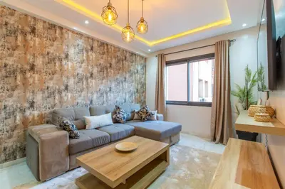a living room with a couch and a table at New! Appartemant au millieu de guéliz in Marrakech