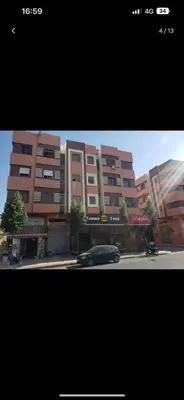 a car parked on a street in front of a building at La koutoubia in Marrakech
