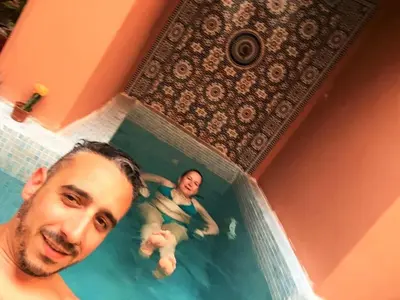 two people are in a bath tub with aermottermott at Riad La Perle de Marrakech in Marrakech