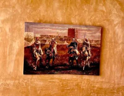 a painting of four soldiers on horses on a wall at Riad Les Miroirs in Marrakech
