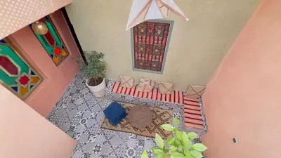an overhead view of a living room with a table and chairs at Riad dar Rbati in Marrakech