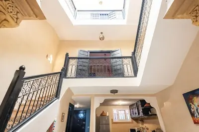 a staircase in a house with a skylight at Riad Anir in Marrakech