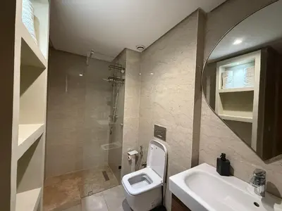 a bathroom with a toilet and a sink at LDM Appartements Marrakech in Marrakech