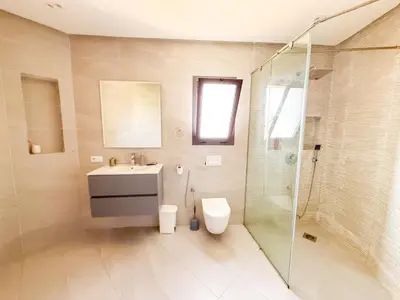 a bathroom with a toilet and a sink and a shower at Villa piscine privée, Détente familiale Marrakech in Marrakech