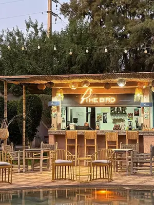 a restaurant with tables and chairs in front of it at The BIRD in Marrakech