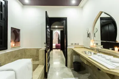 a bathroom with two sinks and a large mirror at The BIRD in Marrakech