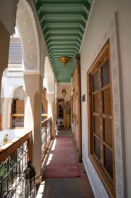 a hallway of a house with a green ceiling at Riad Dar Fanny in Marrakech