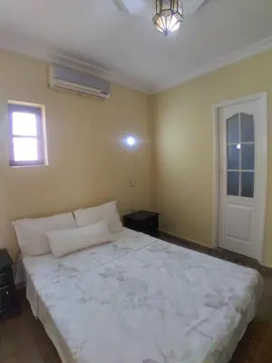 a bedroom with a large white bed in a room at Riad 9 Derb El Bousnne in Marrakech