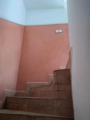 a set of stairs in a room with a ceiling at Riad 9 Derb El Bousnne in Marrakech