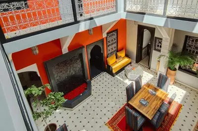 an overhead view of a living room with a table and chairs at Riad Mylaya in Marrakech