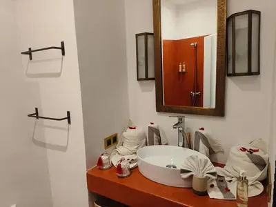 a bathroom with a sink and a mirror at Riad Mylaya in Marrakech