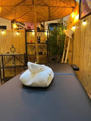 a white pillow sitting on top of a table at Riad Paradise privatisé au cœur des souks in Marrakech