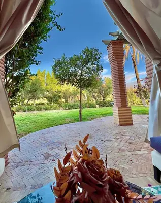 a pile of food sitting on top of a patio at Palmeraie 5 Vue Piscine et Jardin in Marrakech