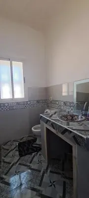 a bathroom with a sink and a toilet at Riad chaoui house in Marrakech