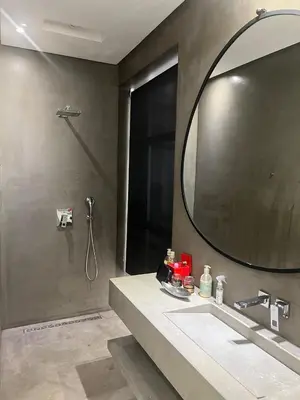 a bathroom with a large mirror and a sink at Villa Dar Balou - FAMILY ONLY in Marrakech