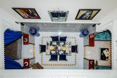 a room with a table with blue plates on it at Riad For S in Marrakech