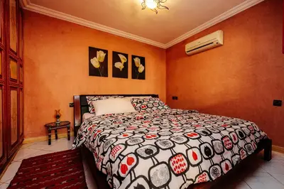 a bedroom with a bed in a room at Riad For S in Marrakech