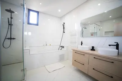 a bathroom with a tub and a sink and a shower at Villa Arabic House Pool & SPA, Marrakech in Marrakech