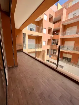 an empty room with a large window in a building at Appartement chambre salon centre de Gueliz 22 in Marrakech