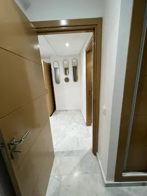 a hallway with a door and a tile floor at PALACE B Av Hassan II Marrakech 40000-Specious UNIT#7 in Marrakech