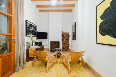 a living room with two chairs and a table at RIAD THE MILESTONE in Marrakech