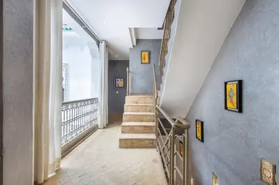 a staircase in a home with a stair case at Riad Princesse Des Sables- Jaccuzzi& SPA-Breakfast in Marrakech