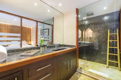 a bathroom with a double sink and a shower at Riad Princesse Des Sables- Jaccuzzi& SPA-Breakfast in Marrakech