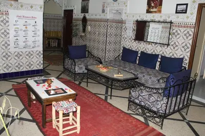 a living room with a couch and a table at Riad Marrakech Medina in Marrakech
