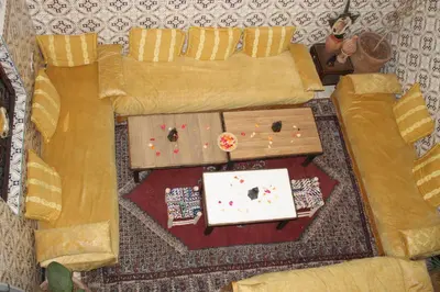a living room with a couch and a table at Riad Marrakech Medina in Marrakech