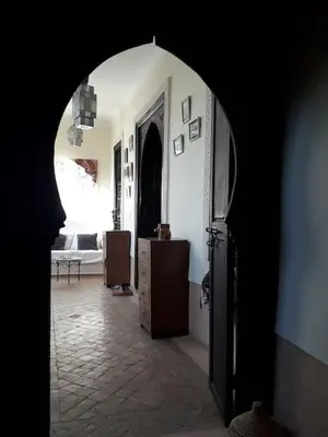 an archway in a room with a living room at Dar Nassima in Marrakech