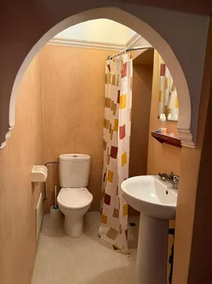 a bathroom with a toilet and a sink at Riad Elijah Marrakech & SPA in Marrakech