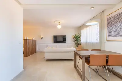 a living room with a table and a couch at ZARI Boutique ApartHotel in Marrakech
