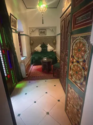an overhead view of a bedroom with a bed and a table at Riad Malida Marrakech in Marrakech