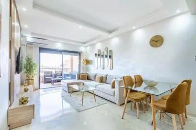 a living room with a couch and a table at New! Superbe appartement à Majorelle,terrace,IPTV. in Marrakech
