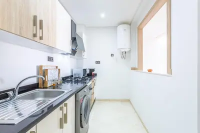 a kitchen with a sink and a dishwasher at New! Superbe appartement à Majorelle,terrace,IPTV. in Marrakech