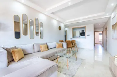 a living room with a couch and a table at New! Superbe appartement à Majorelle,terrace,IPTV. in Marrakech