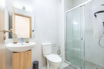 a bathroom with a toilet and a sink and a shower at New! Superbe appartement à Majorelle,terrace,IPTV. in Marrakech