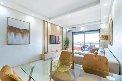 a living room with a couch and a glass table at New! Superbe appartement à Majorelle,terrace,IPTV. in Marrakech
