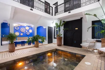 a house with a swimming pool in the middle at Riad JW, La Medina autrement in Marrakech